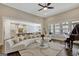 Spacious living room with piano, modern sofa, and open floor plan to kitchen at 270 Blue Point Pkwy, Fayetteville, GA 30215