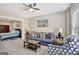 Inviting living room with a blue sofa, patterned armchair, and serene artwork at 270 Blue Point Pkwy, Fayetteville, GA 30215