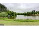 Scenic view of the tranquil pond, with lush greenery creating a peaceful and inviting atmosphere at 270 Blue Point Pkwy, Fayetteville, GA 30215