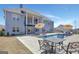 Backyard pool and patio area with umbrellas and seating for entertaining at 270 Blue Point Pkwy, Fayetteville, GA 30215