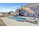 An inviting backyard pool is surrounded by lounge chairs and umbrellas, perfect for relaxing in the sun at 270 Blue Point Pkwy, Fayetteville, GA 30215