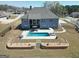 Aerial shot of backyard featuring a gorgeous private pool with a patio and landscaped hardscape at 270 Blue Point Pkwy, Fayetteville, GA 30215