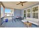 Charming outdoor porch featuring comfortable seating, a ceiling fan, and a serene neighborhood view at 270 Blue Point Pkwy, Fayetteville, GA 30215