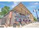 Barleygarden Kitchen and Craft bar with outdoor patio, planters, and street lights on a sunny day at 270 Blue Point Pkwy, Fayetteville, GA 30215
