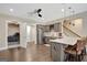 A convenient wet bar features stainless steel appliances, pendant lighting, and bar stool seating at 270 Blue Point Pkwy, Fayetteville, GA 30215