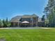Beautiful backyard with pool and chairs sitting under a gazebo at 249 Suffolk Way, Mcdonough, GA 30252