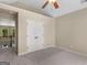 Neutral bedroom with a ceiling fan, ensuite bathroom access, and an oversized closet at 249 Suffolk Way, Mcdonough, GA 30252