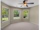 Bedroom with neutral walls and carpeted floors, with natural lighting and window views at 249 Suffolk Way, Mcdonough, GA 30252