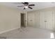 Bedroom with neutral walls and carpet features ample closet space and bright natural light at 249 Suffolk Way, Mcdonough, GA 30252