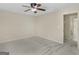 Bedroom with neutral walls and carpeted floors, with a closet and access to the hallway at 249 Suffolk Way, Mcdonough, GA 30252