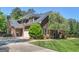 Spacious home featuring a stone chimney, 3-car garage, and mature landscaping at 249 Suffolk Way, Mcdonough, GA 30252