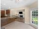 Inviting kitchen with stone countertops open to a cozy living area featuring a fireplace at 249 Suffolk Way, Mcdonough, GA 30252