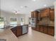 Modern kitchen with stainless steel appliances, granite counters, and an open concept design at 249 Suffolk Way, Mcdonough, GA 30252
