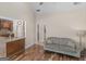 Open living space featuring hardwood floors with bar area and comfortable seating at 249 Suffolk Way, Mcdonough, GA 30252