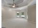 Large main bedroom with neutral walls, plush carpet, and large windows viewing outdoor pool at 249 Suffolk Way, Mcdonough, GA 30252