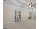 Carpeted main bedroom with tray ceilings and ensuite bath with granite counters at 249 Suffolk Way, Mcdonough, GA 30252