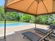 Beautiful pool with lounge chairs under a gazebo at 249 Suffolk Way, Mcdonough, GA 30252