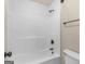 Clean white shower/tub combination featuring bronze fixtures, a sleek design, and ample space at 249 Suffolk Way, Mcdonough, GA 30252