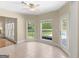 Bright sun room with many windows overlooking a pool, ceramic tile floors and neutral walls at 249 Suffolk Way, Mcdonough, GA 30252