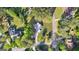 An aerial shot shows the property nestled among mature trees, with a long driveway at 105 Hartford Pl, Fayetteville, GA 30214