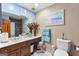 Bathroom features double sinks, beach themed decor, and a tiled shower at 105 Hartford Pl, Fayetteville, GA 30214