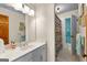 Bathroom with a white vanity, framed mirror, and a colorful shower curtain at 105 Hartford Pl, Fayetteville, GA 30214