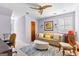 Upstairs bedroom with ceiling fan, neutral decor, and decorative area rug at 105 Hartford Pl, Fayetteville, GA 30214
