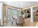 Bright dining area with natural light, modern chandelier, and easy access to the living space at 105 Hartford Pl, Fayetteville, GA 30214