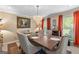 Formal dining room with modern chandelier, stylish chairs, and ample natural light at 105 Hartford Pl, Fayetteville, GA 30214