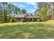 Charming brick home with well-manicured lawn and mature landscaping in a peaceful, established neighborhood at 105 Hartford Pl, Fayetteville, GA 30214
