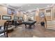 Spacious game room with a pool table, bar, and basketball hoop for entertaining at 105 Hartford Pl, Fayetteville, GA 30214