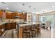 Gourmet kitchen with stainless steel appliances, island seating, and elegant pendant lighting at 105 Hartford Pl, Fayetteville, GA 30214