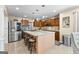 Modern kitchen featuring stainless steel appliances, granite countertops, and ample storage space at 105 Hartford Pl, Fayetteville, GA 30214