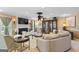 Inviting living room with a fireplace, large cabinet, and plush sofa creating a cozy ambiance at 105 Hartford Pl, Fayetteville, GA 30214