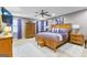 Serene main bedroom featuring a ceiling fan, natural wood furniture, and neutral-toned walls at 105 Hartford Pl, Fayetteville, GA 30214