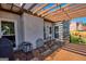 Relaxing back deck featuring patio furniture, a grill, and a stylish pergola at 1730 Carlington Ct, Grayson, GA 30017