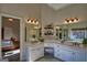 Bright bathroom featuring dual sinks, white cabinets and great lighting at 1730 Carlington Ct, Grayson, GA 30017