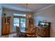 Dining room featuring a large window, hardwood floors, and a decorative chandelier at 1730 Carlington Ct, Grayson, GA 30017