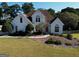 Charming two-story traditional home with lush landscaping and a well-manicured lawn at 1730 Carlington Ct, Grayson, GA 30017