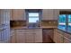 Spacious kitchen featuring stainless appliances, granite countertops and white cabinets at 1730 Carlington Ct, Grayson, GA 30017