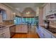Open kitchen with white cabinets, stainless steel appliances, eat in breakfast nook, and hardwood floors at 1730 Carlington Ct, Grayson, GA 30017