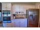 Kitchen with stainless appliances, granite countertops, and white cabinetry at 1730 Carlington Ct, Grayson, GA 30017