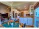 Bright kitchen featuring white cabinets, stainless appliances, and an adjacent breakfast nook with hardwood floors at 1730 Carlington Ct, Grayson, GA 30017