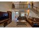 Spacious living room with high ceilings, a staircase, and a view of the foyer at 1730 Carlington Ct, Grayson, GA 30017