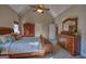 Spacious main bedroom with vaulted ceiling and wooden furniture at 1730 Carlington Ct, Grayson, GA 30017