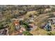 Aerial view of home at 3139 Players Drive nestled among mature trees at 3139 Players Dr, Jonesboro, GA 30236