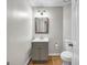 Bathroom featuring grey vanity with modern fixtures at 3139 Players Dr, Jonesboro, GA 30236