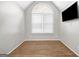 Empty bonus room featuring hardwood floors, neutral walls, and a large window with blinds at 3139 Players Dr, Jonesboro, GA 30236