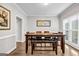 Bright dining room featuring modern table with bench and chair seating and window at 3139 Players Dr, Jonesboro, GA 30236