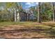 Charming two-story home with neutral siding, trimmed windows, mature landscaping, and a classic architectural style at 3139 Players Dr, Jonesboro, GA 30236